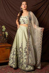 Buy stunning mint green embroidered silk lehenga online in USA with dupatta. Shine at weddings and special occasions with beautiful Indian designer dresses, gowns, lehengas from Pure Elegance Indian clothing store in USA.-full view
