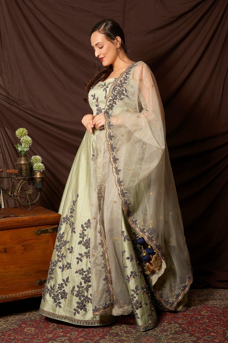Buy stunning mint green embroidered silk lehenga online in USA with dupatta. Shine at weddings and special occasions with beautiful Indian designer dresses, gowns, lehengas from Pure Elegance Indian clothing store in USA.-side