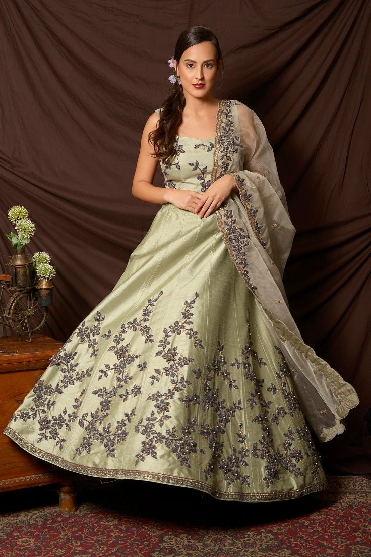 Buy stunning mint green embroidered silk lehenga online in USA with dupatta. Shine at weddings and special occasions with beautiful Indian designer dresses, gowns, lehengas from Pure Elegance Indian clothing store in USA.-ghera