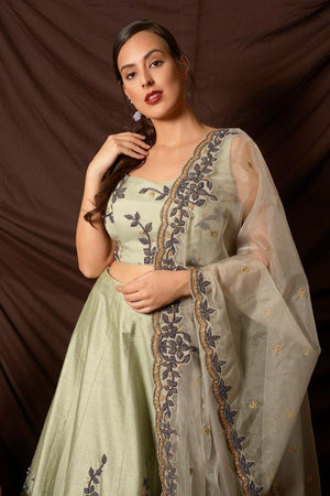 Buy stunning mint green embroidered silk lehenga online in USA with dupatta. Shine at weddings and special occasions with beautiful Indian designer dresses, gowns, lehengas from Pure Elegance Indian clothing store in USA.-closeup