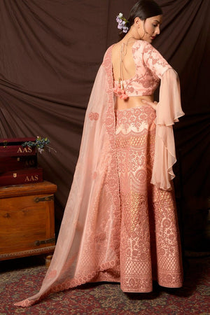 Shop lovely peach color embroidered silk lehenga online in USA with dupatta. Shine at weddings and special occasions with beautiful Indian designer dresses, gowns, lehengas from Pure Elegance Indian clothing store in USA.-back