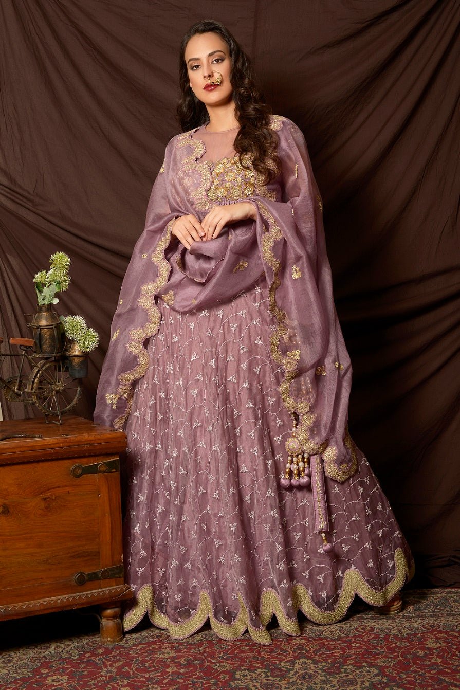 Buy attractive mauve color embroidered organza lehenga online in USA with dupatta. Shine at weddings and special occasions with beautiful Indian designer dresses, gowns, lehengas from Pure Elegance Indian clothing store in USA.-front