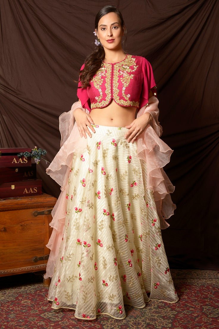 Shop gorgeous pink peplum cape embroidered organza lehenga online in USA. Shine at weddings and special occasions with beautiful Indian designer dresses, gowns, lehengas from Pure Elegance Indian clothing store in USA.-front
