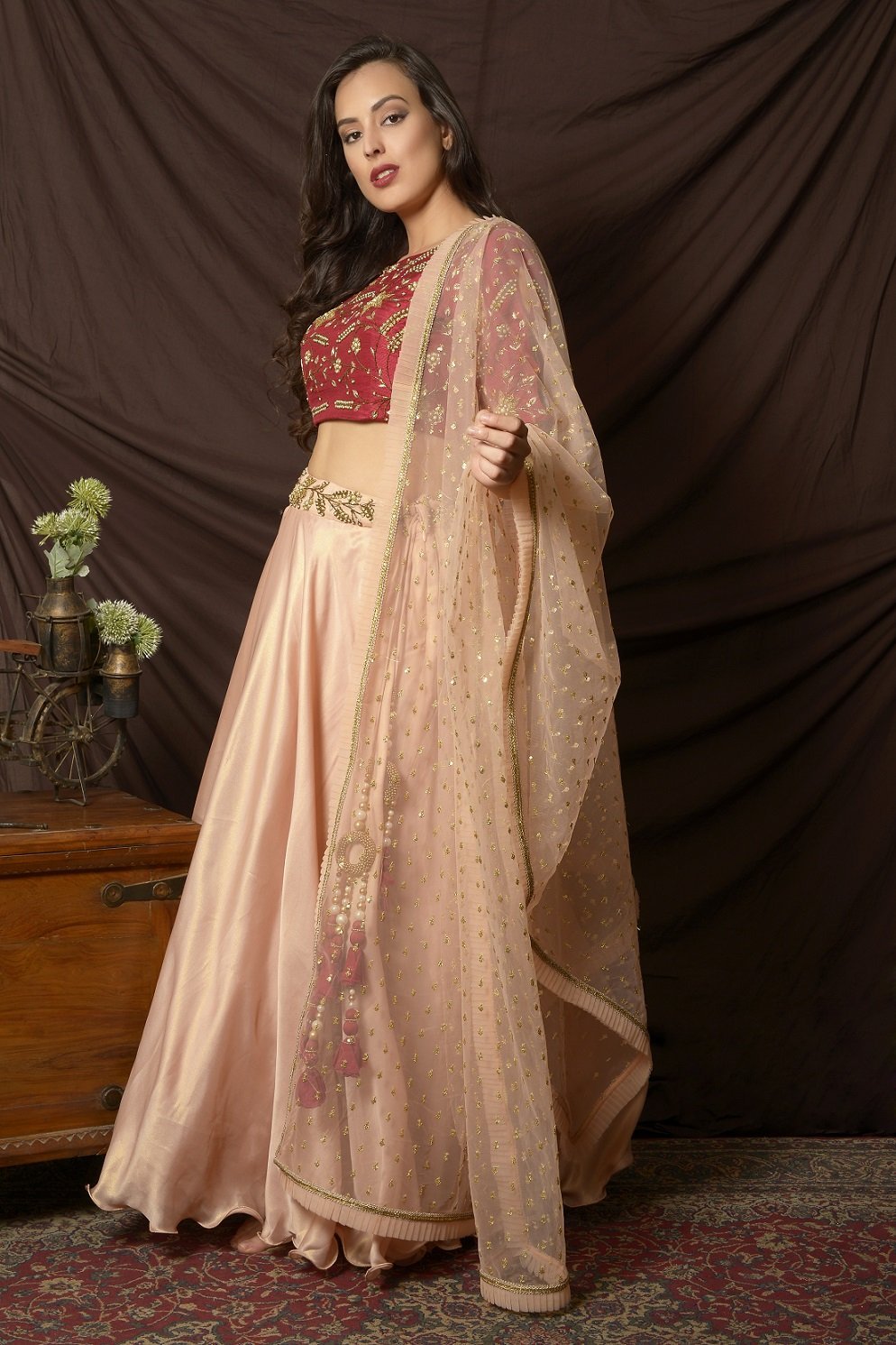 Buy stunning peach and red embroidered shimmer chiffon lehenga online in USA with dupatta. Shine at weddings and special occasions with beautiful Indian designer dresses, gowns, lehengas from Pure Elegance Indian clothing store in USA.-left side