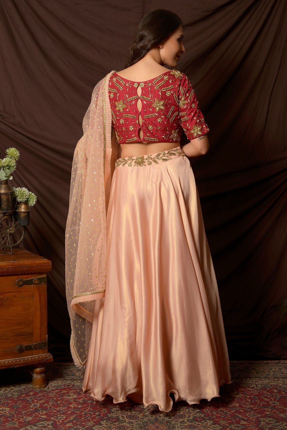 Buy stunning peach and red embroidered shimmer chiffon lehenga online in USA with dupatta. Shine at weddings and special occasions with beautiful Indian designer dresses, gowns, lehengas from Pure Elegance Indian clothing store in USA.-back