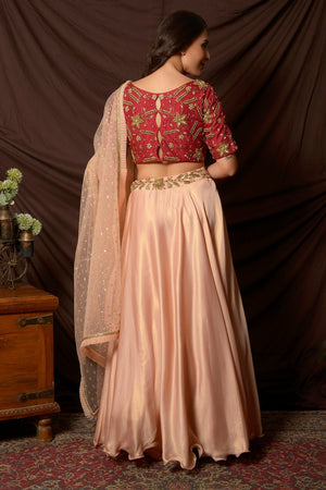 Buy stunning peach and red embroidered shimmer chiffon lehenga online in USA with dupatta. Shine at weddings and special occasions with beautiful Indian designer dresses, gowns, lehengas from Pure Elegance Indian clothing store in USA.-back