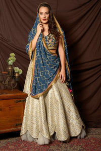 Shop beautiful blue and silver embroidered brocade lehenga online in USA with  dupatta. Shine at weddings and special occasions with beautiful Indian designer dresses, gowns, lehengas from Pure Elegance Indian clothing store in USA.-full view