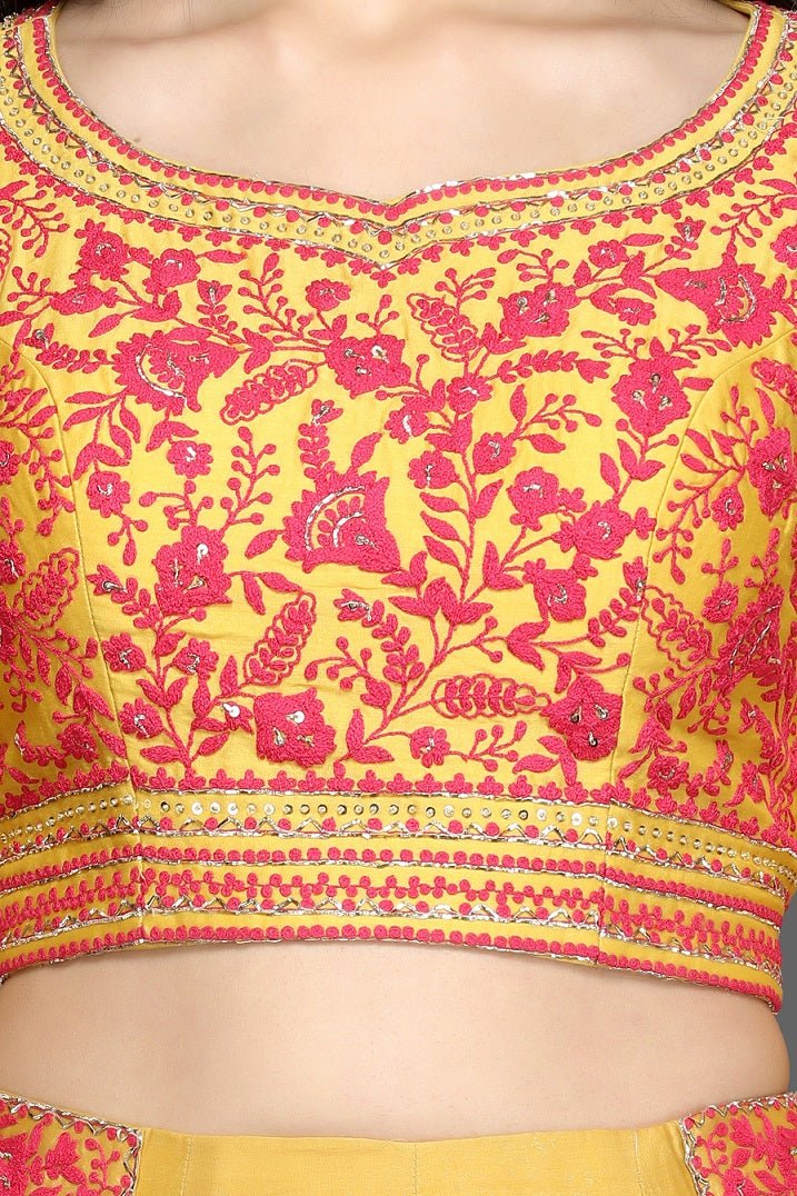 Buy gorgeous yellow embroidered lehenga online in USA with red and orange dupatta. Dazzle on weddings and special occasions with exquisite Indian designer dresses, sharara suits, Anarkali suits, bridal lehegas from Pure Elegance Indian fashion store in USA.-closeup