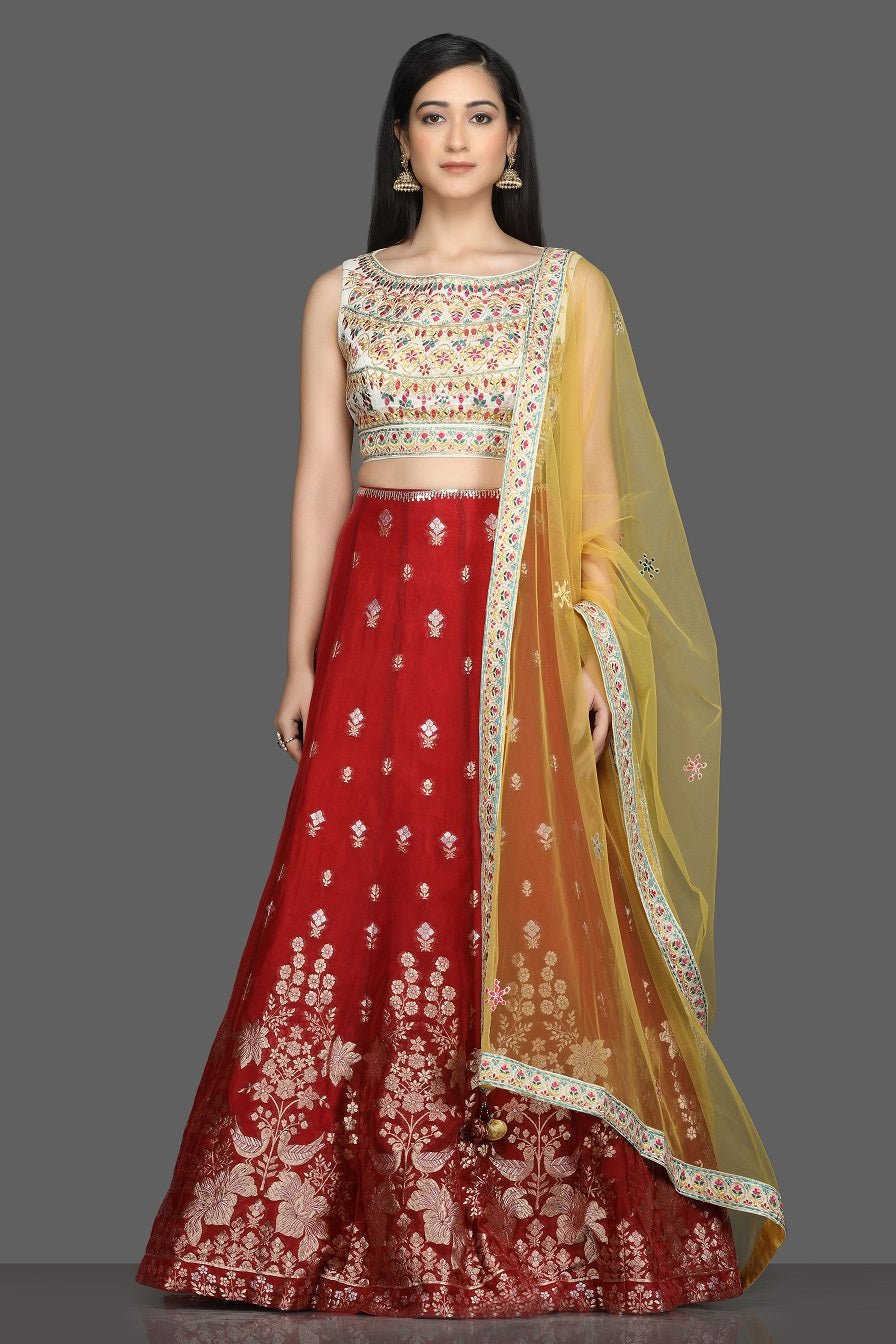 Buy beautiful cream and red embroidered lehenga online in USA with yellow dupatta. Dazzle on weddings and special occasions with exquisite Indian designer dresses, sharara suits, Anarkali suits, bridal lehegas from Pure Elegance Indian fashion store in USA.-full view