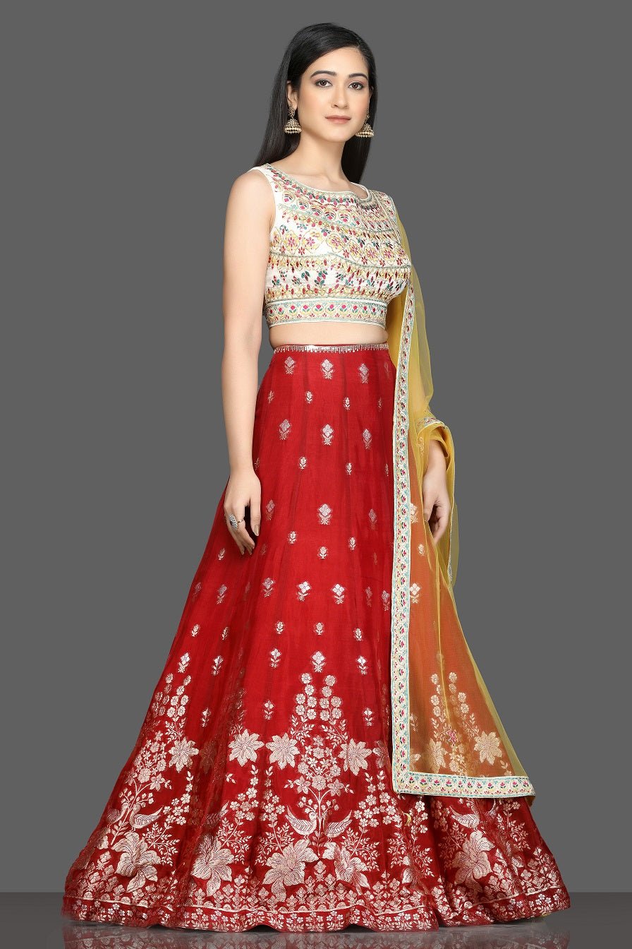 Buy beautiful cream and red embroidered lehenga online in USA with yellow dupatta. Dazzle on weddings and special occasions with exquisite Indian designer dresses, sharara suits, Anarkali suits, bridal lehegas from Pure Elegance Indian fashion store in USA.-side