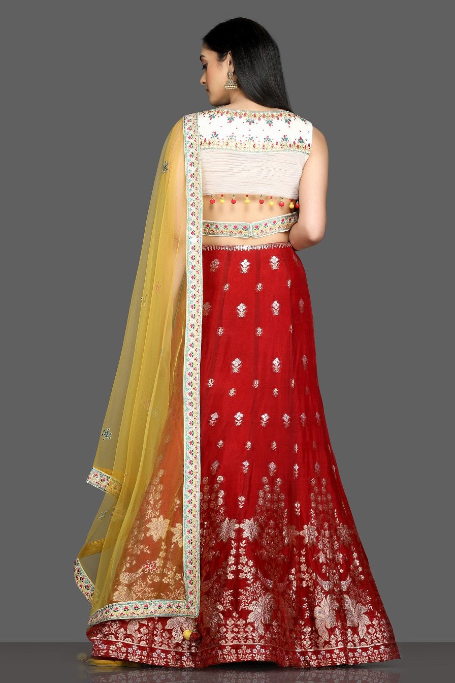 Buy beautiful cream and red embroidered lehenga online in USA with yellow dupatta. Dazzle on weddings and special occasions with exquisite Indian designer dresses, sharara suits, Anarkali suits, bridal lehegas from Pure Elegance Indian fashion store in USA.-back