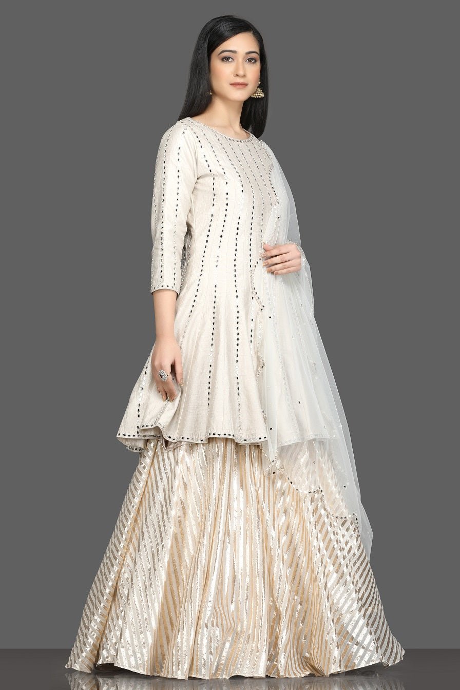Shop beautiful white mirror work peplum lehenga online in USA with net dupatta. Dazzle on weddings and special occasions with exquisite Indian designer dresses, sharara suits, Anarkali suits, bridal lehegas from Pure Elegance Indian fashion store in USA.-side