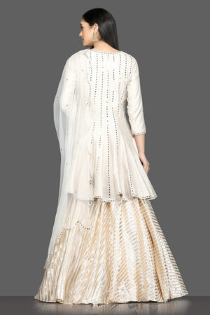 Shop beautiful white mirror work peplum lehenga online in USA with net dupatta. Dazzle on weddings and special occasions with exquisite Indian designer dresses, sharara suits, Anarkali suits, bridal lehegas from Pure Elegance Indian fashion store in USA.-back