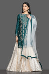 Buy stunning green and white embroidered lehenga online in USA with net dupatta. Dazzle on weddings and special occasions with exquisite Indian designer dresses, sharara suits, Anarkali suits, bridal lehengas from Pure Elegance Indian fashion store in USA.-full view