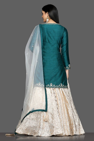 Buy stunning green and white embroidered lehenga online in USA with net dupatta. Dazzle on weddings and special occasions with exquisite Indian designer dresses, sharara suits, Anarkali suits, bridal lehengas from Pure Elegance Indian fashion store in USA.-back
