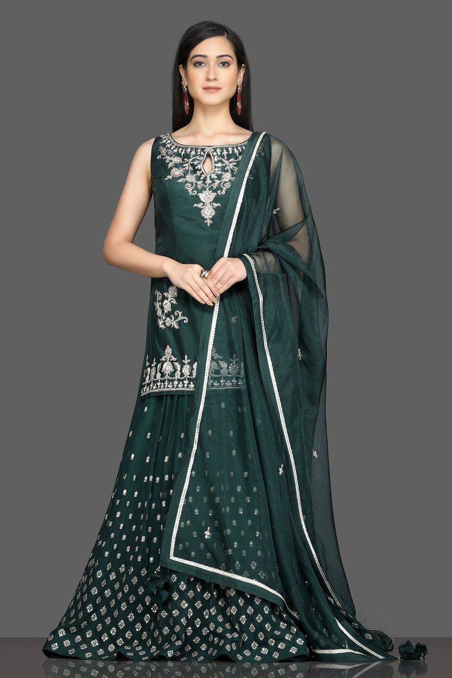 Buy stunning dark green embroidered lehenga online in USA with matching dupatta. Dazzle on weddings and special occasions with exquisite Indian designer dresses, sharara suits, Anarkali suits, wedding lehengas from Pure Elegance Indian fashion store in USA.-full view