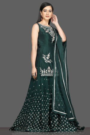Buy stunning dark green embroidered lehenga online in USA with matching dupatta. Dazzle on weddings and special occasions with exquisite Indian designer dresses, sharara suits, Anarkali suits, wedding lehengas from Pure Elegance Indian fashion store in USA.-side