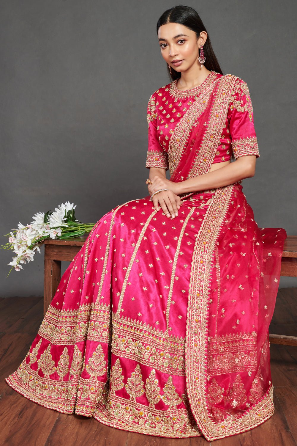 Shop gorgeous pink embroidered designer lehenga online in USA. Dazzle on weddings and special occasions with exquisite Indian designer dresses, sharara suits, Anarkali suits, wedding lehengas from Pure Elegance Indian fashion store in USA.-full view