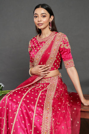 Shop gorgeous pink embroidered designer lehenga online in USA. Dazzle on weddings and special occasions with exquisite Indian designer dresses, sharara suits, Anarkali suits, wedding lehengas from Pure Elegance Indian fashion store in USA.-closeup