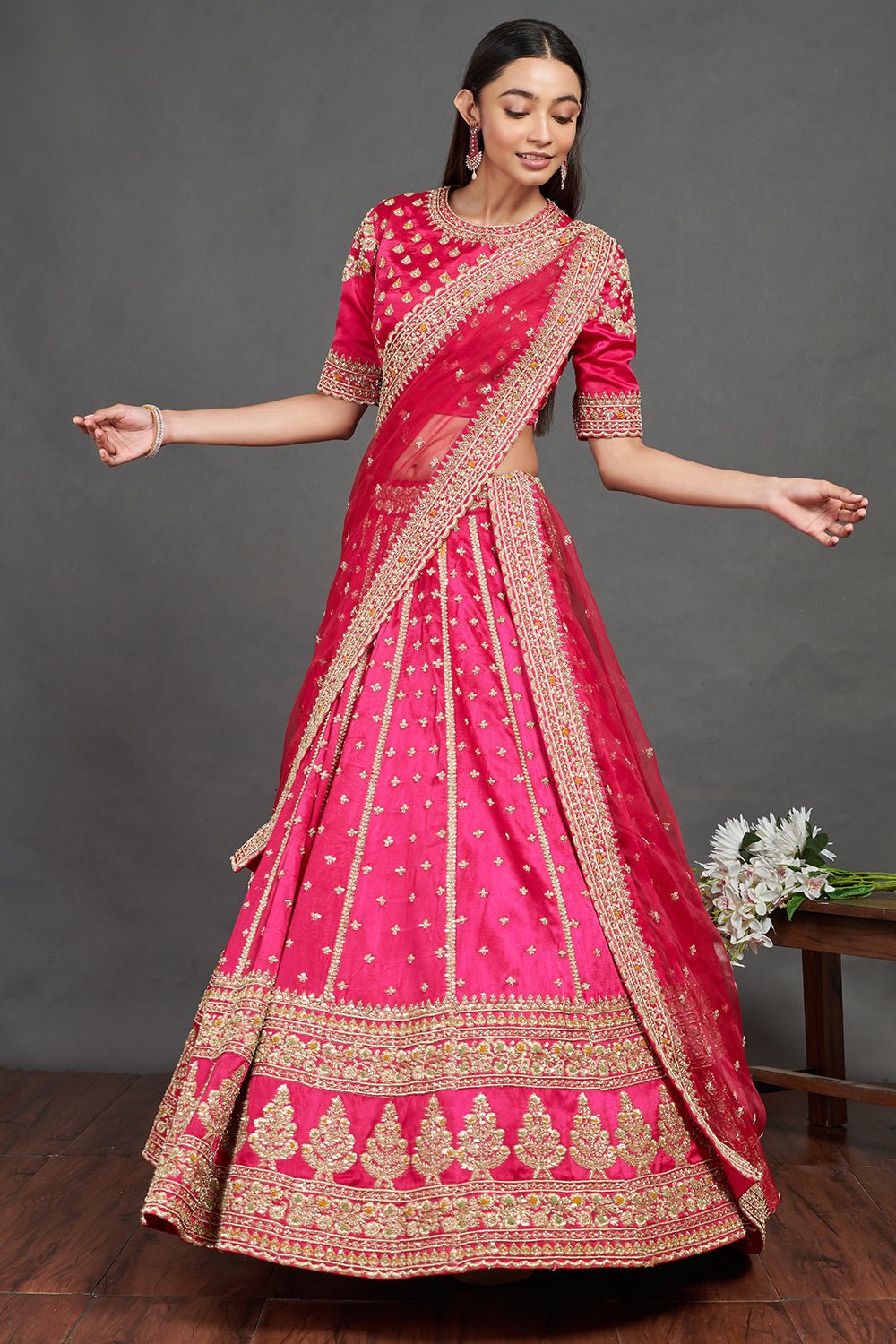Shop gorgeous pink embroidered designer lehenga online in USA. Dazzle on weddings and special occasions with exquisite Indian designer dresses, sharara suits, Anarkali suits, wedding lehengas from Pure Elegance Indian fashion store in USA.-lehenga
