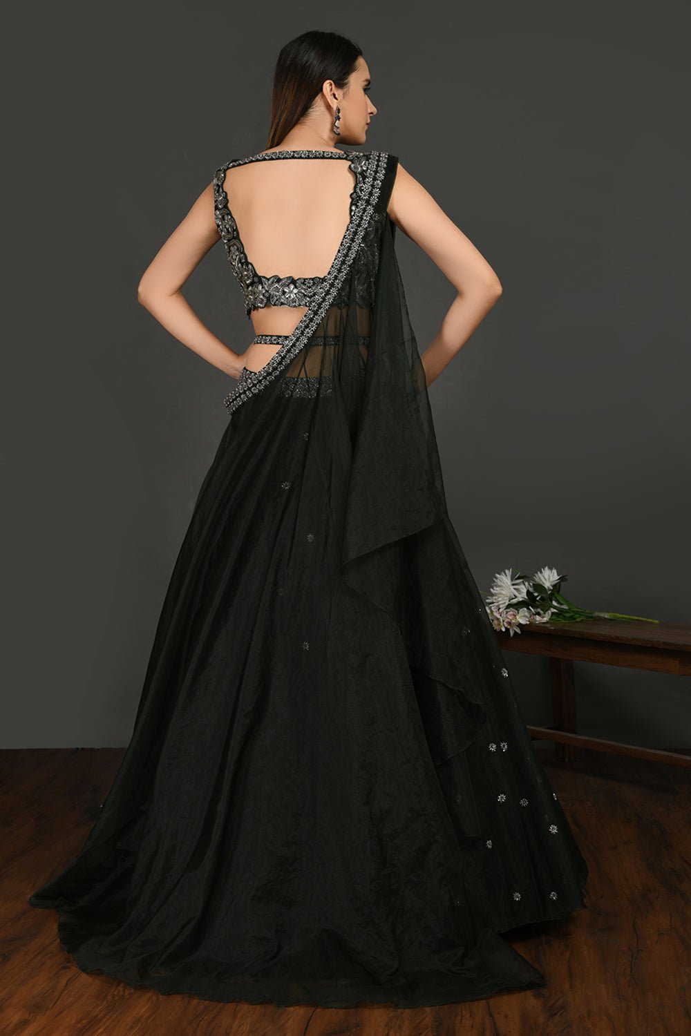 Buy stunning black embroidered designer lehenga online in USA with dupatta. Dazzle on weddings and special occasions with exquisite Indian designer dresses, sharara suits, Anarkali suits, wedding lehengas from Pure Elegance Indian fashion store in USA.-back