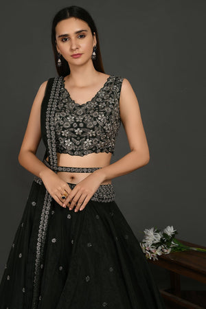 Buy stunning black embroidered designer lehenga online in USA with dupatta. Dazzle on weddings and special occasions with exquisite Indian designer dresses, sharara suits, Anarkali suits, wedding lehengas from Pure Elegance Indian fashion store in USA.-closeup