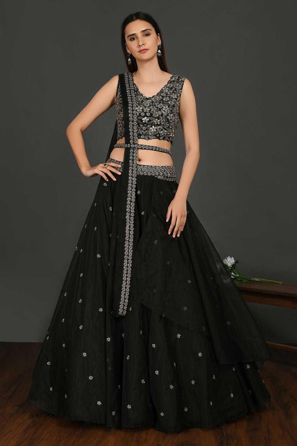 Buy stunning black embroidered designer lehenga online in USA with dupatta. Dazzle on weddings and special occasions with exquisite Indian designer dresses, sharara suits, Anarkali suits, wedding lehengas from Pure Elegance Indian fashion store in USA.-full view
