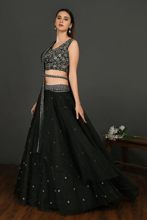Buy stunning black embroidered designer lehenga online in USA with dupatta. Dazzle on weddings and special occasions with exquisite Indian designer dresses, sharara suits, Anarkali suits, wedding lehengas from Pure Elegance Indian fashion store in USA.-left