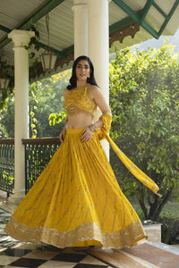 Buy stunning canary yellow hand embroidered lehenga online in USA with dupatta. Dazzle on weddings and special occasions with exquisite Indian designer dresses, sharara suits, Anarkali suits, wedding lehengas from Pure Elegance Indian fashion store in USA.-full view