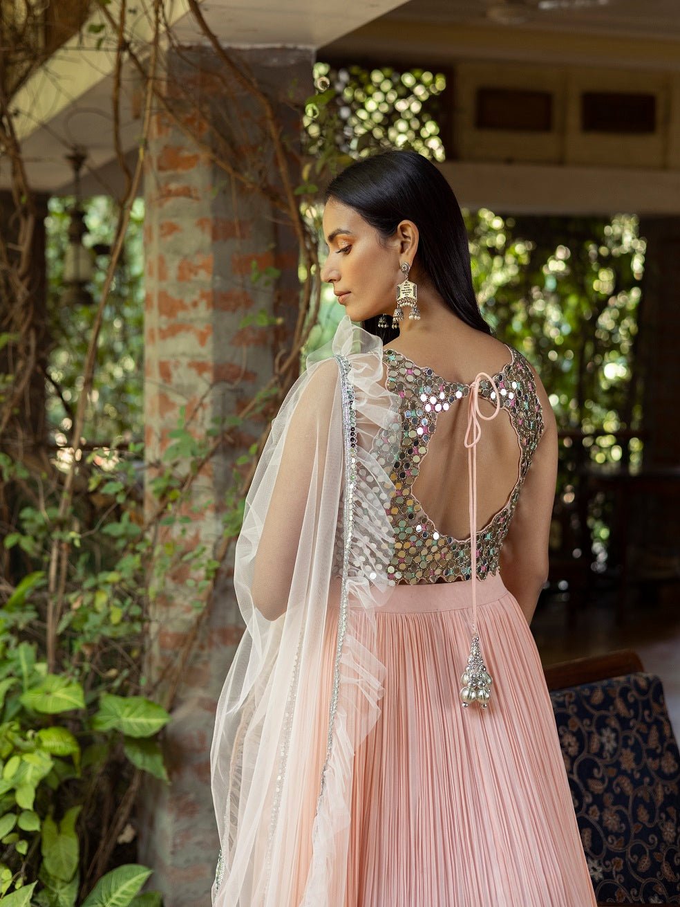 Shop beautiful salmon pink mirror work lehenga online in USA with dupatta. Dazzle on weddings and special occasions with exquisite Indian designer dresses, sharara suits, Anarkali suits, wedding lehengas from Pure Elegance Indian fashion store in USA.-back
