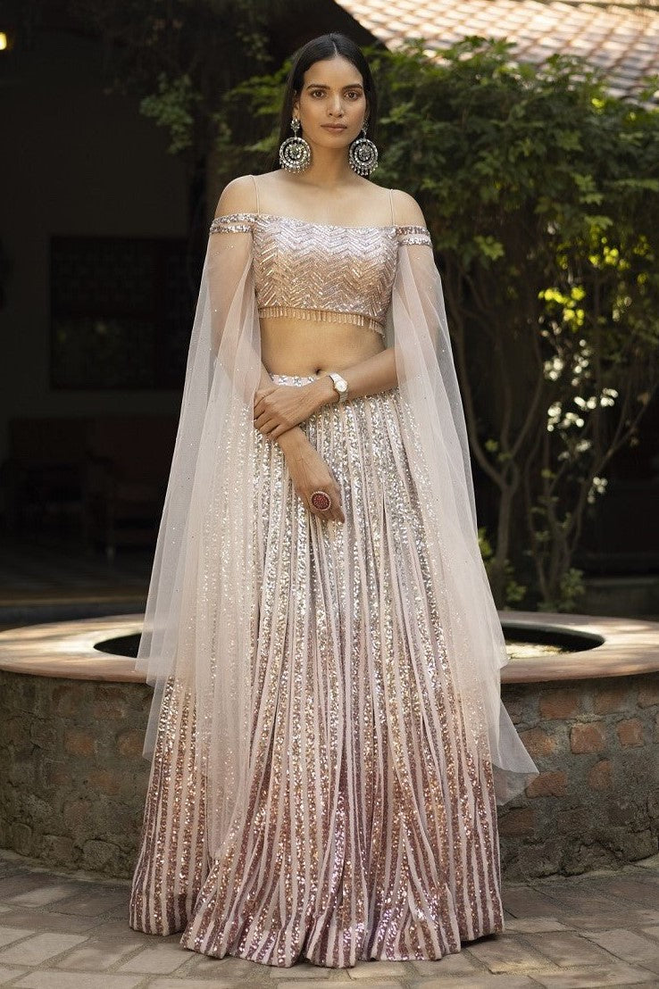 Buy stunning ombre peach shimmer designer lehenga online in USA with dupatta. Dazzle on weddings and special occasions with exquisite Indian designer dresses, sharara suits, Anarkali suits, wedding lehengas from Pure Elegance Indian fashion store in USA.-full view