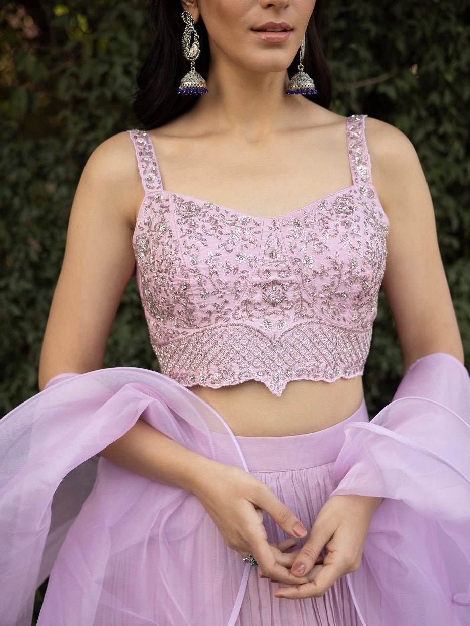 Buy stunning lavender layered designer lehenga online in USA with dupatta. Dazzle on weddings and special occasions with exquisite Indian designer dresses, sharara suits, Anarkali suits, wedding lehengas from Pure Elegance Indian fashion store in USA.-blouse