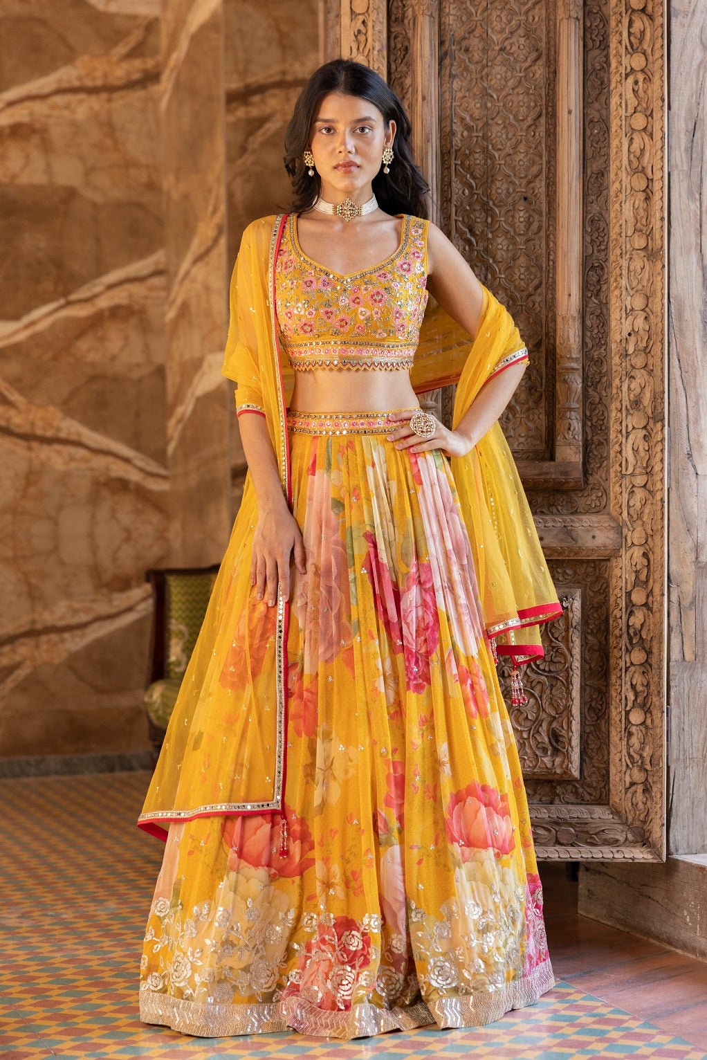 Shop beautiful yellow embroidered floral georgette lehenga online in USA with dupatta. Dazzle on weddings and special occasions with exquisite Indian designer dresses, sharara suits, Anarkali suits, bridal lehengas, sharara suits from Pure Elegance Indian clothing store in USA.-full view