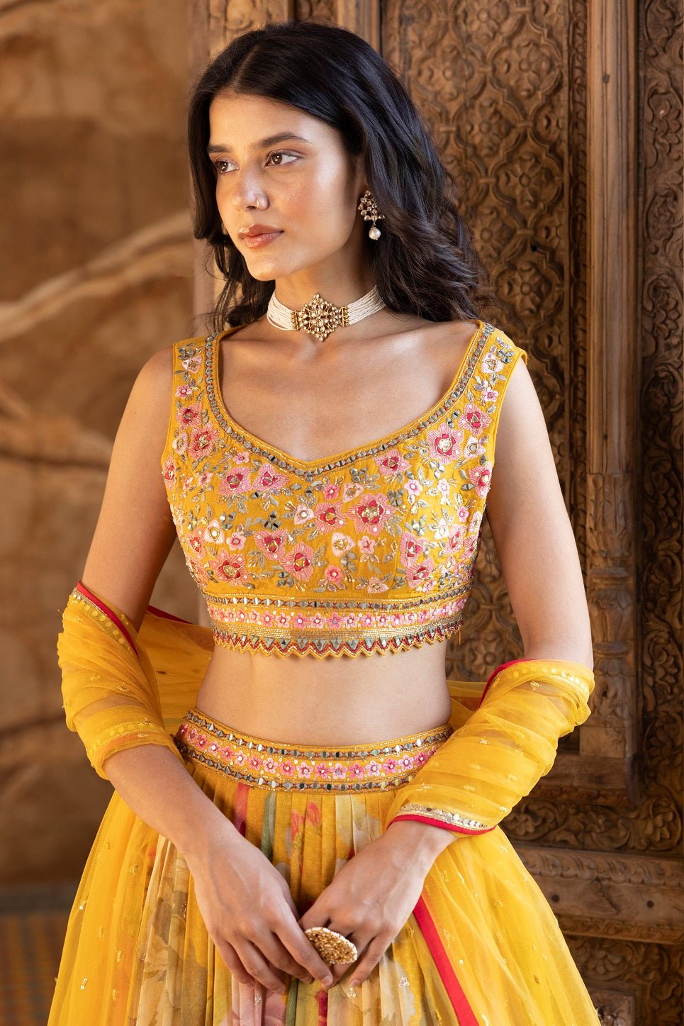 Shop beautiful yellow embroidered floral georgette lehenga online in USA with dupatta. Dazzle on weddings and special occasions with exquisite Indian designer dresses, sharara suits, Anarkali suits, bridal lehengas, sharara suits from Pure Elegance Indian clothing store in USA.-blouse