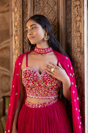 Buy beautiful rani pink embroidered lehenga online in USA with dupatta. Dazzle on weddings and special occasions with exquisite Indian designer dresses, sharara suits, Anarkali suits, bridal lehengas, sharara suits from Pure Elegance Indian clothing store in USA.-blouse