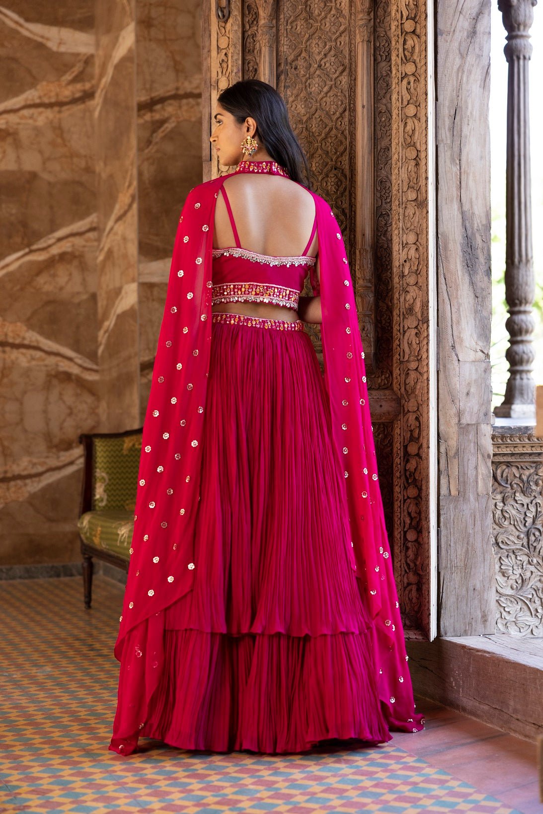Buy beautiful rani pink embroidered lehenga online in USA with dupatta. Dazzle on weddings and special occasions with exquisite Indian designer dresses, sharara suits, Anarkali suits, bridal lehengas, sharara suits from Pure Elegance Indian clothing store in USA.-back