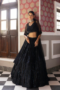 Buy black sequin embroidery lehenga online in USA with velvet blouse and dupatta. Dazzle on weddings and special occasions with exquisite Indian designer dresses, sharara suits, Anarkali suits, bridal lehengas, sharara suits from Pure Elegance Indian clothing store in USA.-full view