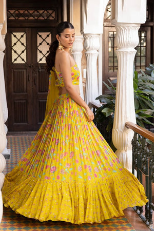 Buy yellow printed georgette georgette lehenga online in USA with dupatta. Dazzle on weddings and special occasions with exquisite Indian designer dresses, sharara suits, Anarkali suits, bridal lehengas, sharara suits from Pure Elegance Indian clothing store in USA.-side