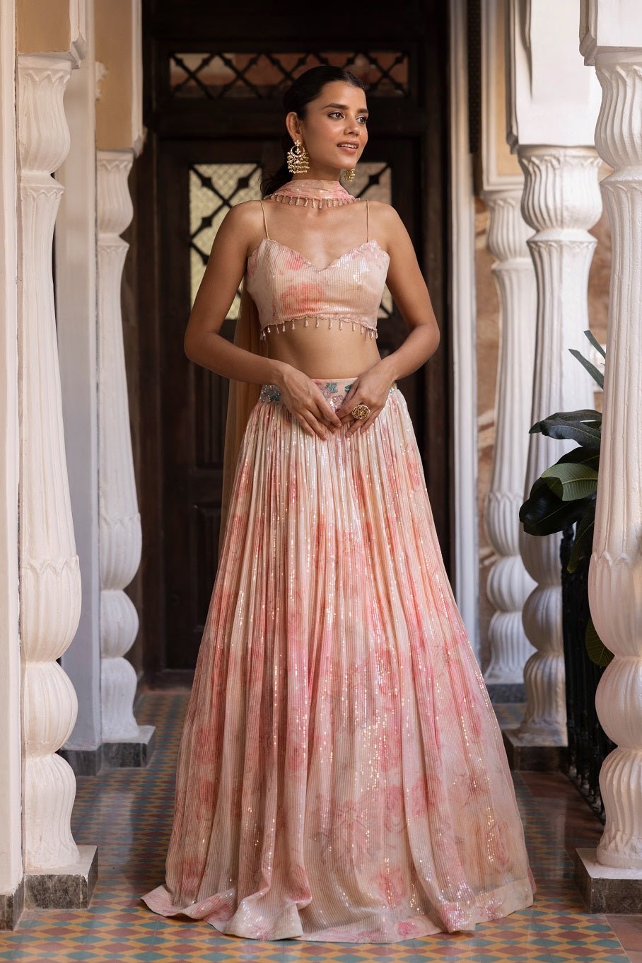 Shop beautiful baby pink sequin and printed lehenga online in USA with dupatta. Dazzle on weddings and special occasions with exquisite Indian designer dresses, sharara suits, Anarkali suits, bridal lehengas, sharara suits from Pure Elegance Indian clothing store in USA.-full view