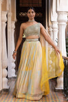 Buy yellow printed georgette lehenga online in USA with attached dupatta. Dazzle on weddings and special occasions with exquisite Indian designer dresses, sharara suits, Anarkali suits, bridal lehengas, sharara suits from Pure Elegance Indian clothing store in USA.-full view