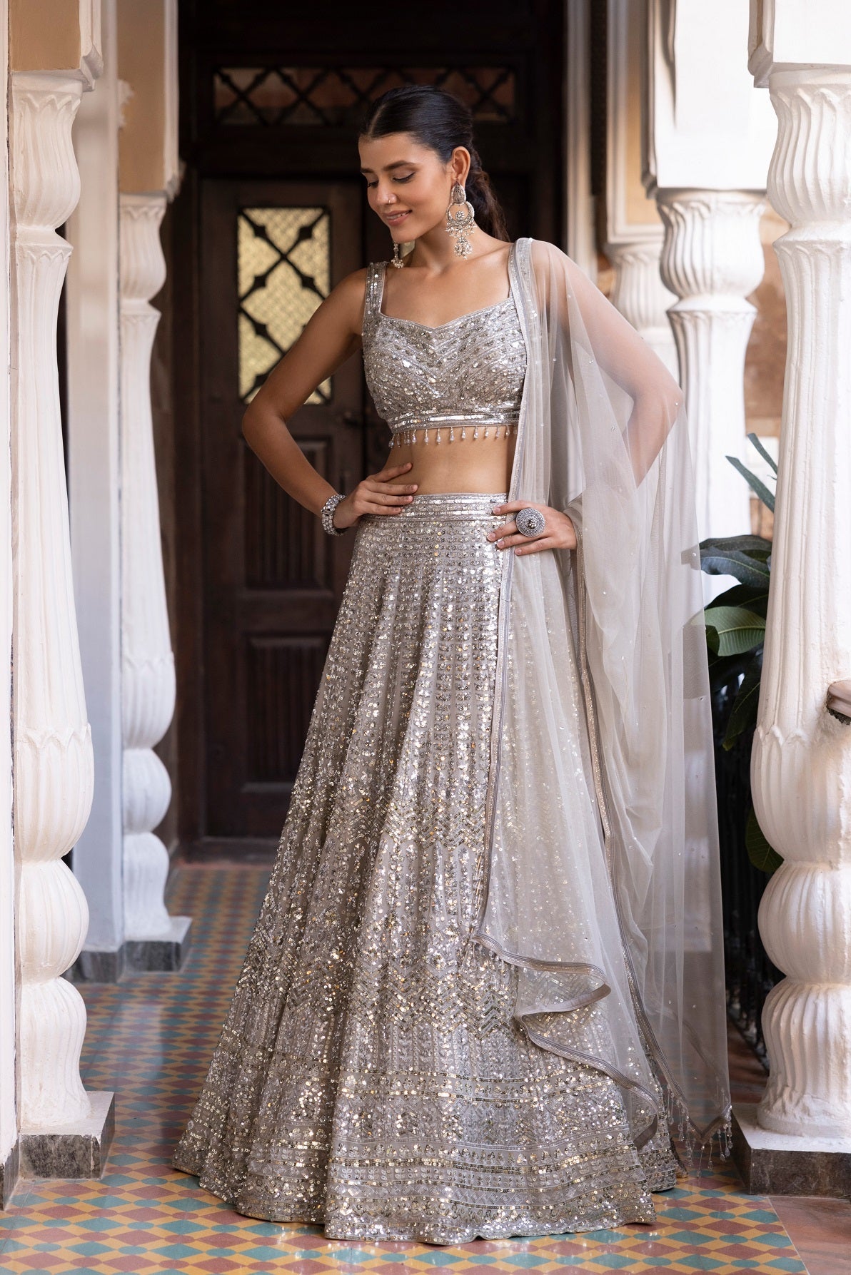 Shop beautiful ivory sequin embroidery lehenga online in USA with dupatta. Dazzle on weddings and special occasions with exquisite Indian designer dresses, sharara suits, Anarkali suits, bridal lehengas, sharara suits from Pure Elegance Indian clothing store in USA.-full view