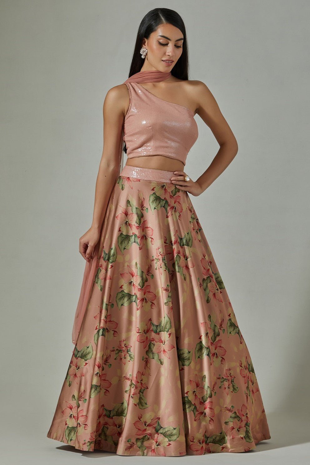 Shop beautiful peach printed designer lehenga online in USA with sequin blouse. Dazzle on weddings and special occasions with exquisite Indian designer dresses, sharara suits, Anarkali suits, wedding lehengas from Pure Elegance Indian fashion store in USA.-front