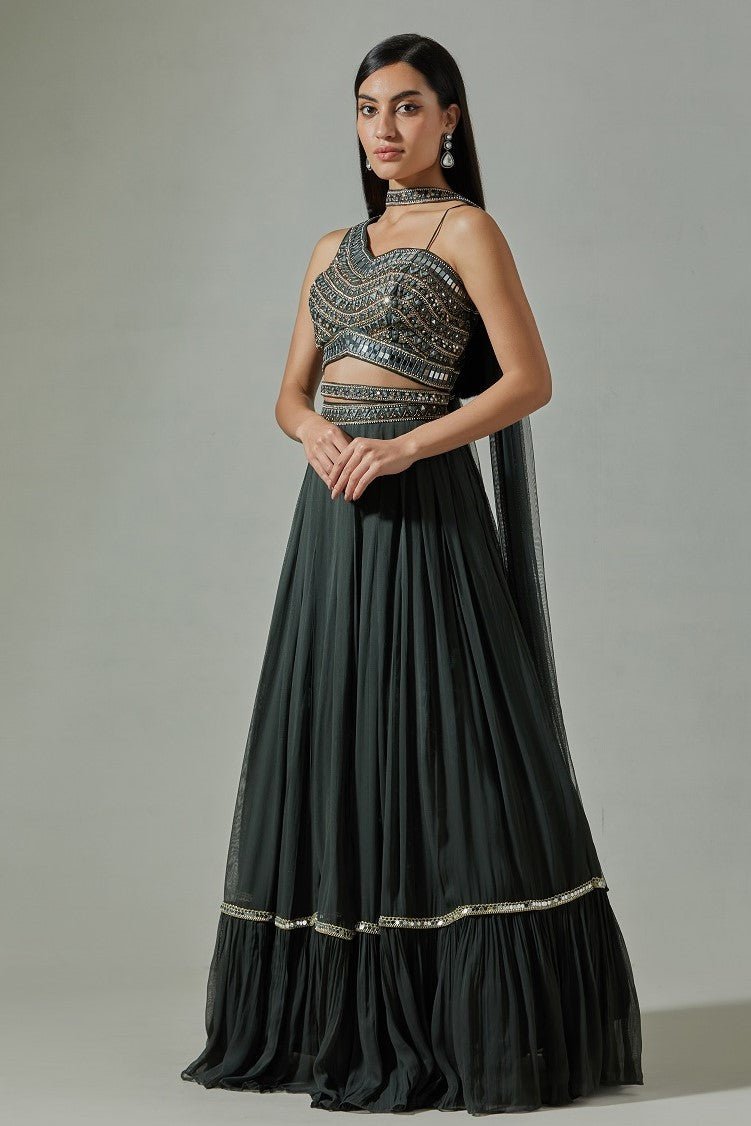 Buy beautiful black georgette designer lehenga online in USA with mirror work blouse. Dazzle on weddings and special occasions with exquisite Indian designer dresses, sharara suits, Anarkali suits, wedding lehengas from Pure Elegance Indian fashion store in USA.-side