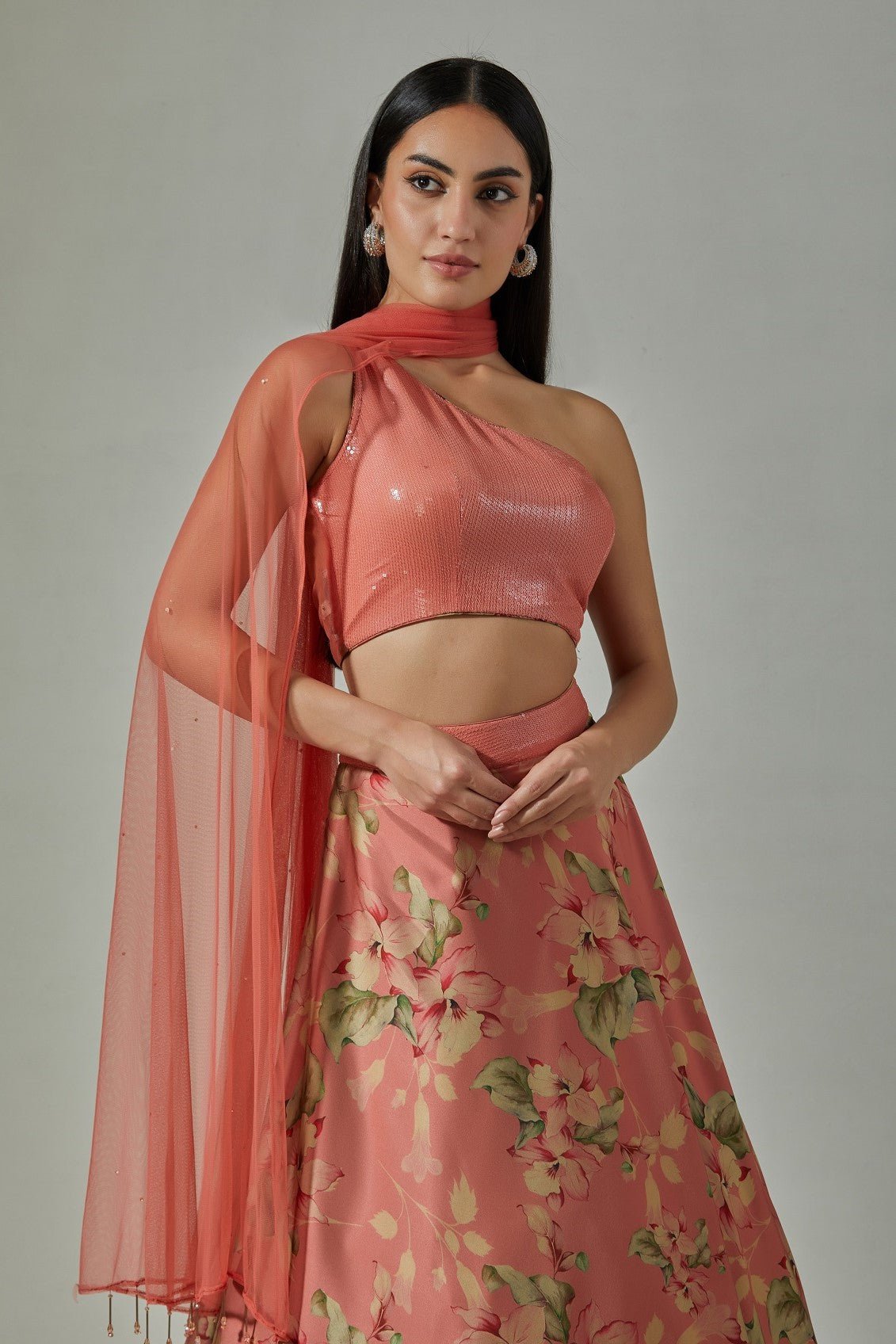 Shop beautiful pink printed satin lehenga online in USA with sequin blouse. Dazzle on weddings and special occasions with exquisite Indian designer dresses, sharara suits, Anarkali suits, wedding lehengas from Pure Elegance Indian fashion store in USA.-closeup
