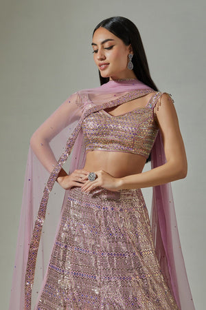 Buy beautiful lilac georgette foil work lehenga online in USA with net blouse. Dazzle on weddings and special occasions with exquisite Indian designer dresses, sharara suits, Anarkali suits, wedding lehengas from Pure Elegance Indian fashion store in USA.-closeup