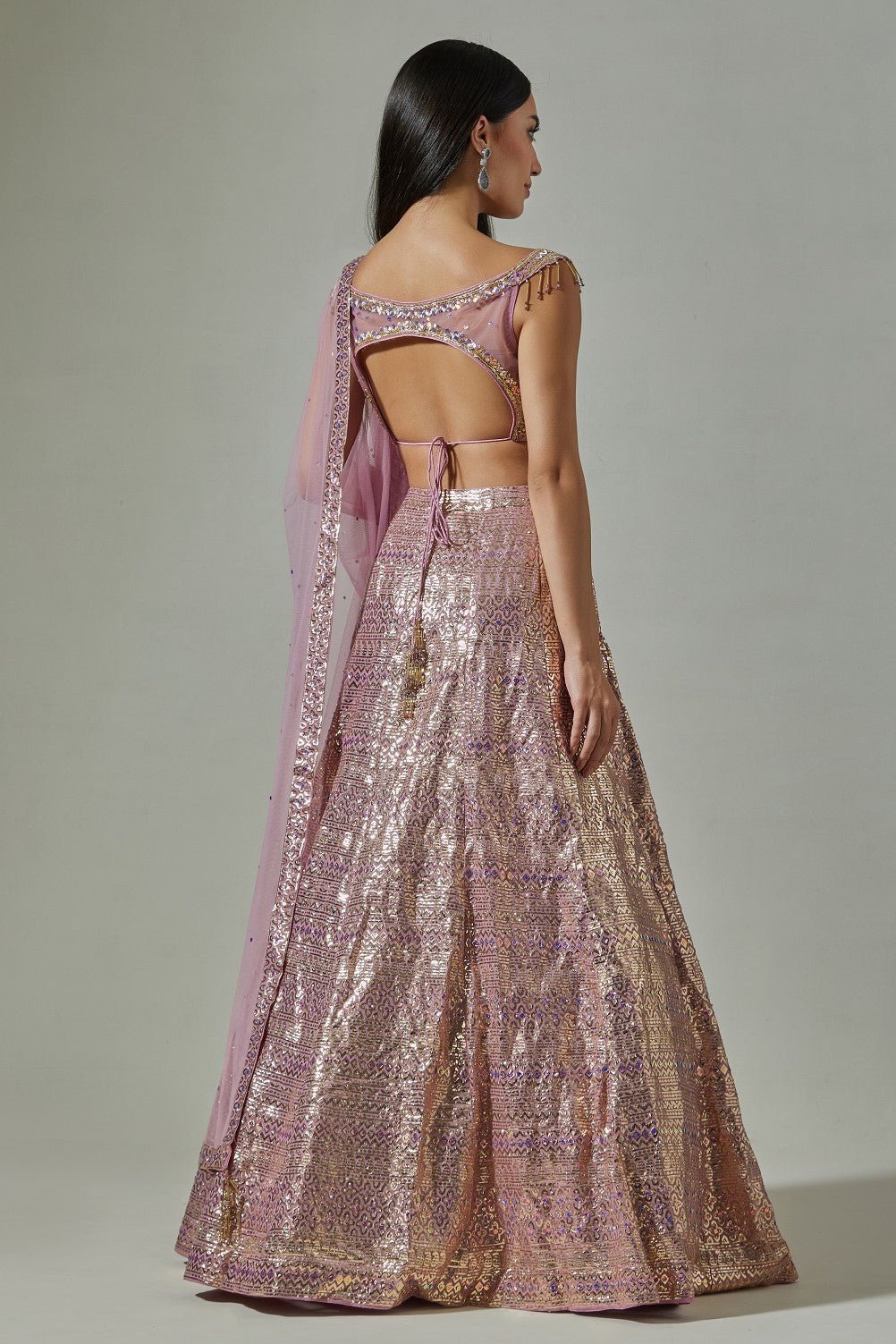 Buy beautiful lilac georgette foil work lehenga online in USA with net blouse. Dazzle on weddings and special occasions with exquisite Indian designer dresses, sharara suits, Anarkali suits, wedding lehengas from Pure Elegance Indian fashion store in USA.-back
