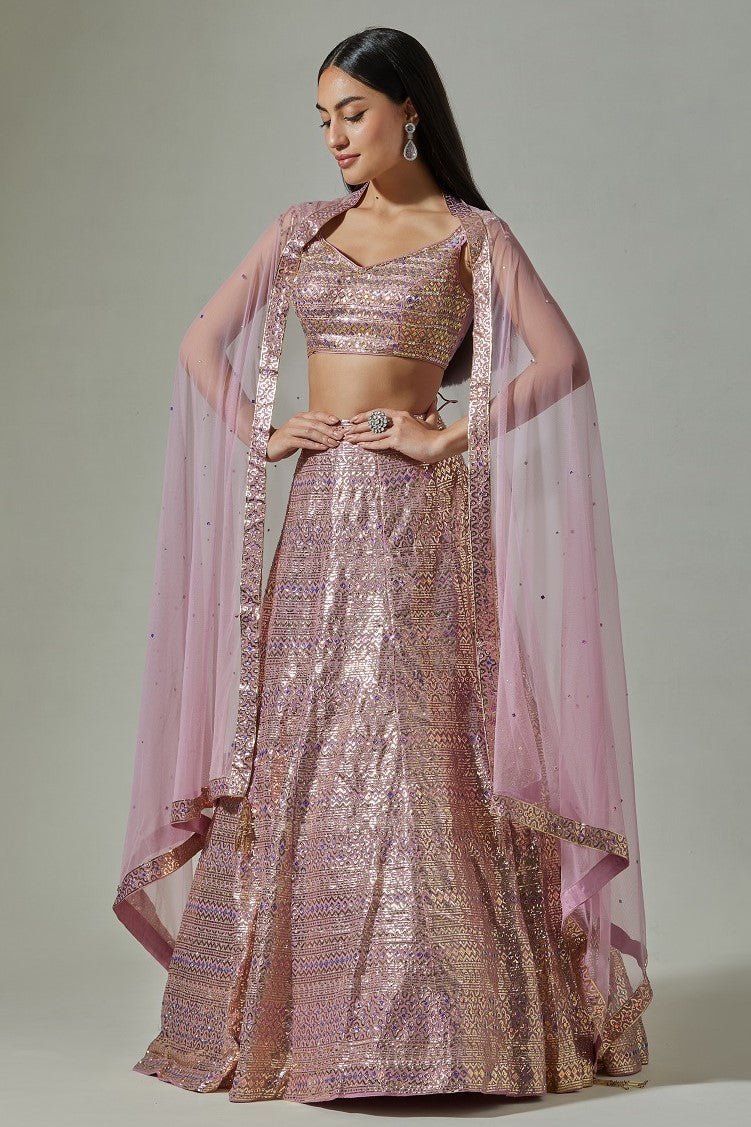 Buy beautiful lilac georgette foil work lehenga online in USA with net blouse. Dazzle on weddings and special occasions with exquisite Indian designer dresses, sharara suits, Anarkali suits, wedding lehengas from Pure Elegance Indian fashion store in USA.-side