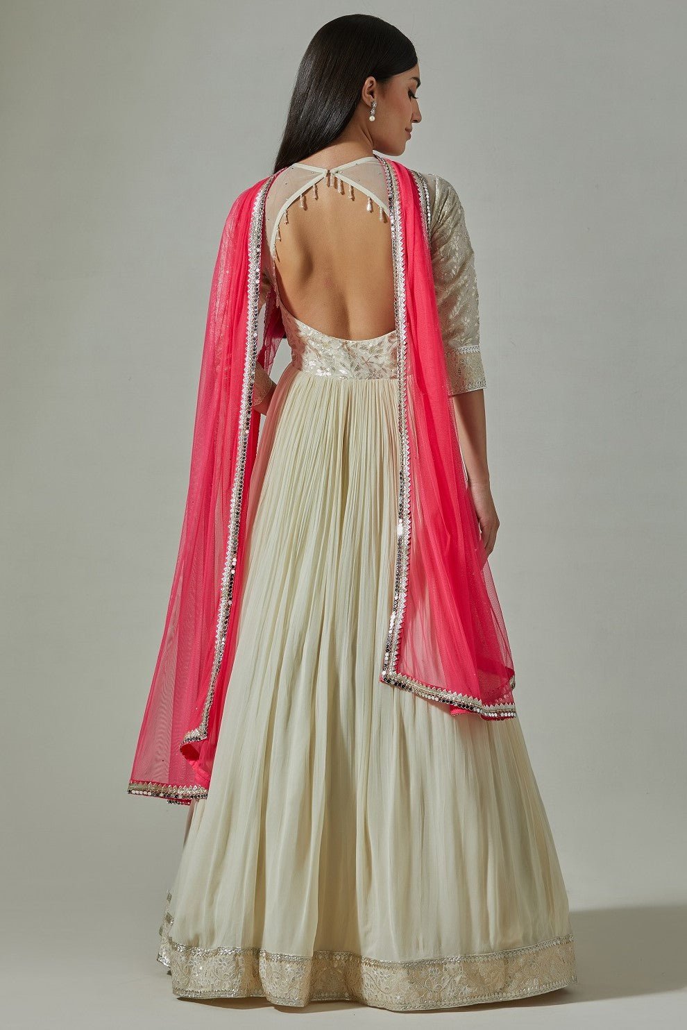Buy beautiful ivory embroidered Anarkali online in USA with pink dupatta. Dazzle on weddings and special occasions with exquisite Indian designer dresses, sharara suits, Anarkali suits, wedding lehengas from Pure Elegance Indian fashion store in USA.-back