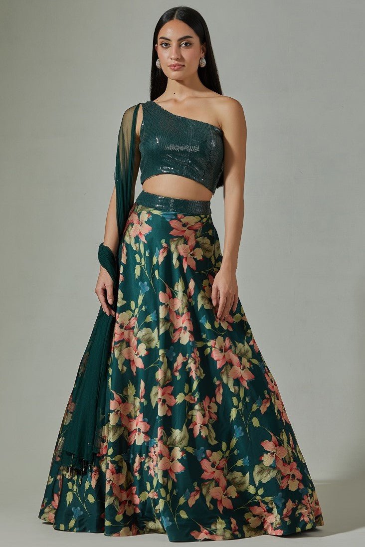 Shop beautiful teal printed satin lehenga online in USA with sequin blouse. Dazzle on weddings and special occasions with exquisite Indian designer dresses, sharara suits, Anarkali suits, wedding lehengas from Pure Elegance Indian fashion store in USA.-full view