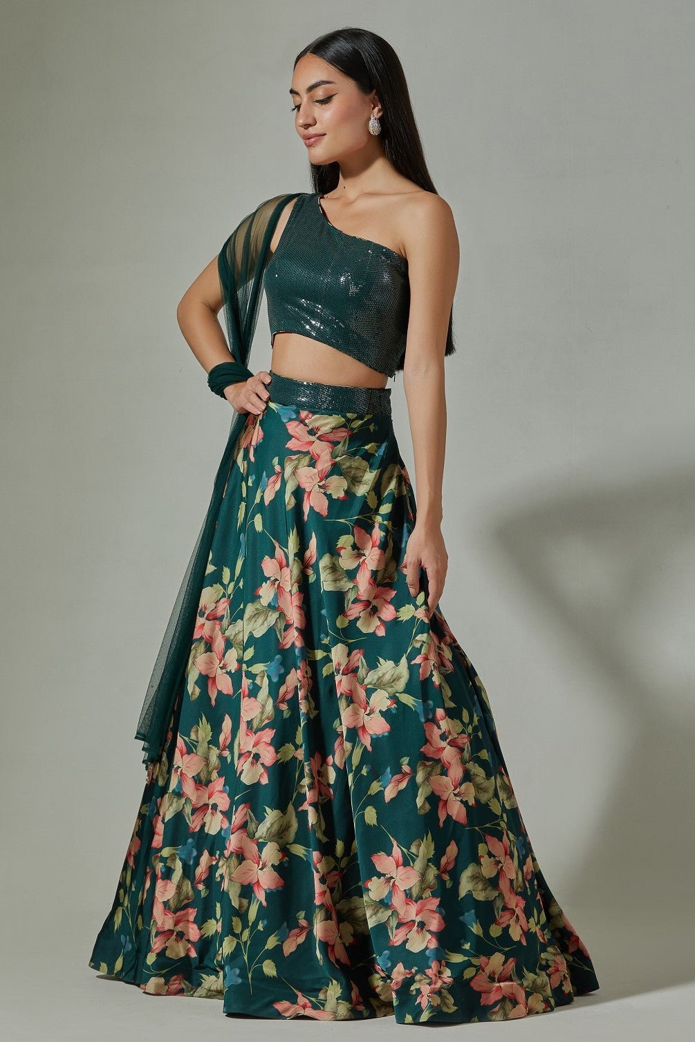 Shop beautiful teal printed satin lehenga online in USA with sequin blouse. Dazzle on weddings and special occasions with exquisite Indian designer dresses, sharara suits, Anarkali suits, wedding lehengas from Pure Elegance Indian fashion store in USA.-side